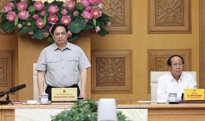 Thủ tướng Phạm Minh Chính chủ trì họp ứng phó cơn bão số 4. (Ảnh: Dương Giang/TTXVN)