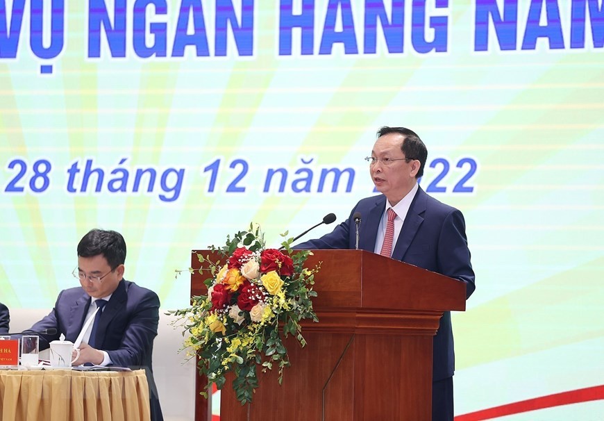 Phó Thống đốc Ngân hàng Nhà nước Đào Minh Tú báo cáo kết quả hoạt động ngân hàng năm 2022, định hướng điều hành năm 2023. (Ảnh: Dương Giang/TTXVN)