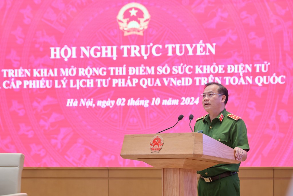 Trung tướng Nguyễn Văn Long, Thứ trưởng Bộ Công an báo cáo tại Hội nghị - Ảnh: VGP/Nhật Bắc