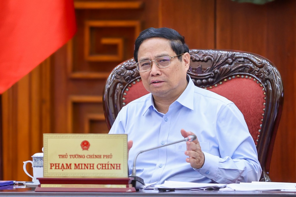 Thủ tướng Chính phủ Phạm Minh Chính nhấn mạnh, cuộc họp nhằm triển khai thực hiện Nghị quyết của Trung ương và Kết luận của Bộ Chính trị về chủ trương đầu tư Dự án đường sắt tốc độ cao trên trục Bắc-Nam - Ảnh: VGP/Nhật Bắc