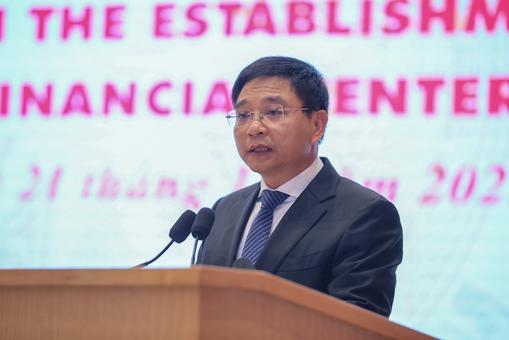 Bộ trưởng Bộ Tài chính Nguyễn Văn Thắng công bố Quyết định của Thủ tướng Chính phủ về thành lập Hội đồng điều hành Trung tâm tài chính quốc tế tại Việt Nam - Ảnh: VGP/Nhật Bắc