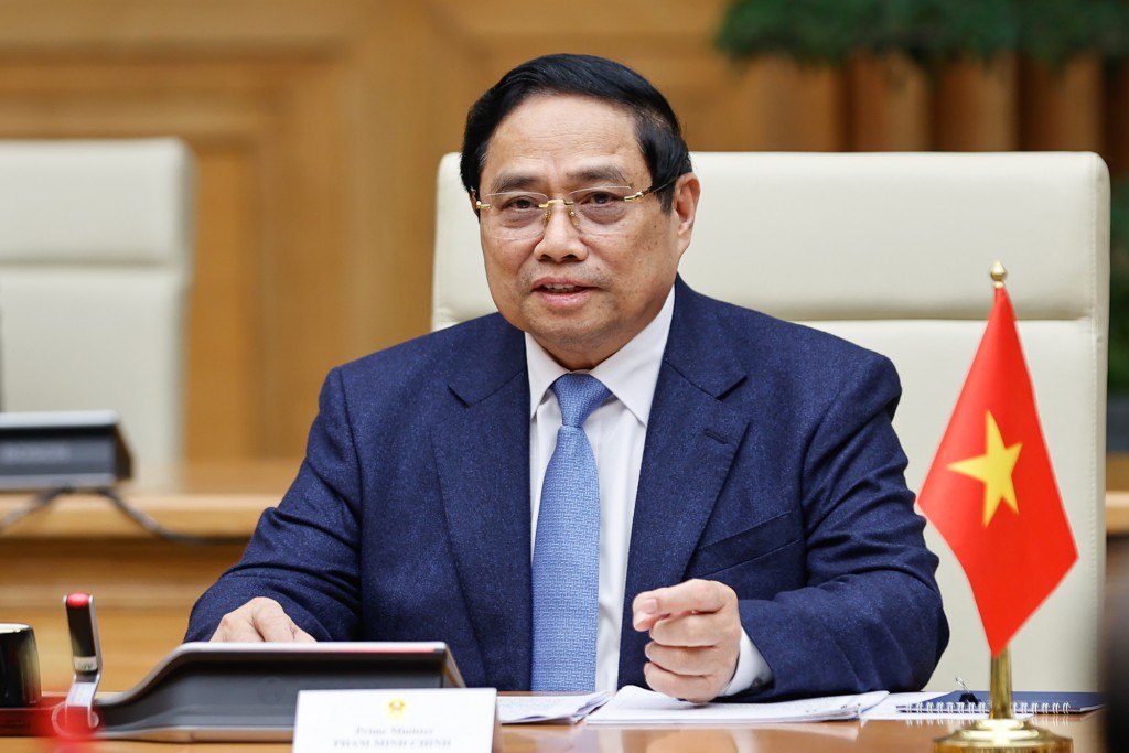 Thủ tướng Chính phủ Phạm Minh Chính nhiệt liệt chúc mừng đồng chí Thongloun Sisoulith tiếp tục được tín nhiệm bầu giữ chức Tổng Bí thư Đảng Nhân dân Cách mạng Lào khóa XII - Ảnh: VGP/Nhật Bắc