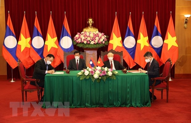 Lễ ký kết Thỏa thuận hợp tác giữa hai Văn phòng Trung ương của hai Đảng giai đoạn 2021-2025. (Ảnh: Trí Dũng/TTXVN)