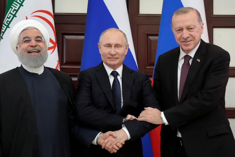 Tổng thống Nga Vladimir Putin, Tổng thống Thổ Nhĩ Kỳ Tayyip Erdogan và Tổng thống Cộng hòa Hồi giáo Iran Hassan Rouhani đã thông qua tuyên bố chung về kết quả của hội nghị thượng đỉnh ba bên. Các nhà lãnh đạo bày tỏ quyết tâm chống lại các kế hoạch ly khai nhằm phá hoại chủ quyền và toàn vẹn lãnh thổ của Syria, cũng như an ninh quốc gia của các nước láng giềng. Ảnh: Reuters