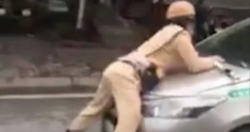 Hà Nội: Tạm giữ hình sự tài xế taxi hất Trung úy CSGT lên nắp capô