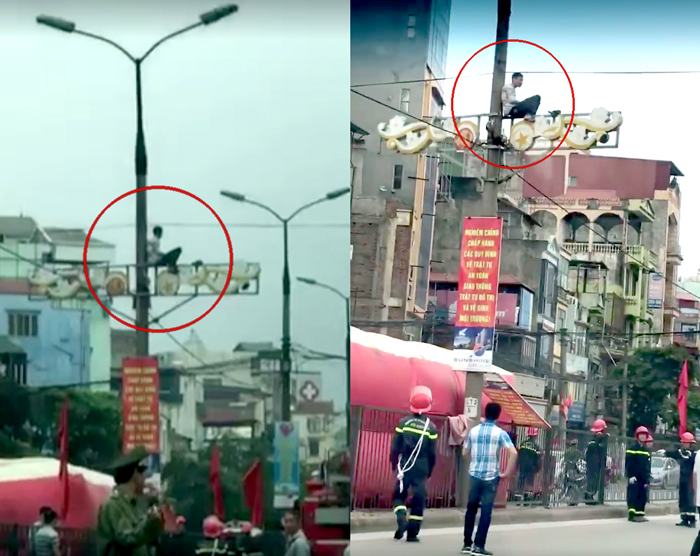 Hà Nội: Nam thanh niên nghi ngáo đá ngồi vắt vẻo trên cột điện